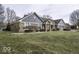 Charming brick home with an attached two-car garage, brick accents, and well-kept landscaping at 8901 Rocky Ridge Rd, Indianapolis, IN 46217