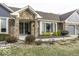 Attractive brick home with a brick entryway, manicured bushes, and an attached garage at 8901 Rocky Ridge Rd, Indianapolis, IN 46217
