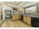 Open kitchen featuring stainless steel appliances, cabinetry, and view to dining area at 8901 Rocky Ridge Rd, Indianapolis, IN 46217