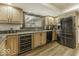 Updated kitchen with stainless steel appliances, sleek countertops, and wine refrigerator at 8901 Rocky Ridge Rd, Indianapolis, IN 46217