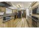 Well-equipped kitchen with stainless steel appliances, wood cabinets, and ample counter space at 8901 Rocky Ridge Rd, Indianapolis, IN 46217