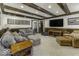 Comfortable living area with plush seating, a large TV, and stylish decor at 8901 Rocky Ridge Rd, Indianapolis, IN 46217