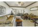 Spacious living room with comfortable furniture, wood trim, and abundant natural light at 8901 Rocky Ridge Rd, Indianapolis, IN 46217