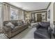 Comfortable living room with plush seating, large windows, and decorative trim at 8901 Rocky Ridge Rd, Indianapolis, IN 46217