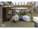 Outdoor deck with wood pergola perfect for entertaining, plus furniture covered for protection from weather at 8901 Rocky Ridge Rd, Indianapolis, IN 46217