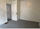 Clean bedroom with neutral walls, gray carpet, and simple design at 1023 Union St, Columbus, IN 47201