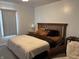 Comfortable bedroom showcasing a bed, bedside tables, and a window with blinds at 1023 Union St, Columbus, IN 47201