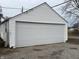Spacious garage with a large white door offers ample parking and storage, perfect for any homeowner at 1023 Union St, Columbus, IN 47201