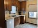Functional kitchen featuring wood cabinets, laminate countertops, and ample natural light at 1023 Union St, Columbus, IN 47201