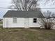 A quaint outdoor storage shed, perfect for gardening tools and equipment, features white siding at 1023 Union St, Columbus, IN 47201