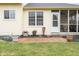 Backyard featuring a screened-in porch, windows, a door, and a brick paver patio at 11866 Weathered Edge Dr, Fishers, IN 46037