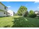 Expansive backyard with lush lawn and mature trees, perfect for outdoor activities at 11866 Weathered Edge Dr, Fishers, IN 46037