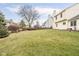 A spacious backyard with a well-maintained lawn and a wooden fence at 11866 Weathered Edge Dr, Fishers, IN 46037