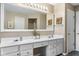 Well-lit bathroom features a double vanity, large mirror, and neutral decor at 11866 Weathered Edge Dr, Fishers, IN 46037