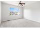 Carpeted bedroom with natural light and view of neighborhood at 11866 Weathered Edge Dr, Fishers, IN 46037