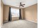Neutral bedroom with carpet, curtains, and a ceiling fan at 11866 Weathered Edge Dr, Fishers, IN 46037
