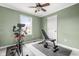 This room would make a perfect home gym, and includes a bench, a bicycle, and rubber flooring at 11866 Weathered Edge Dr, Fishers, IN 46037