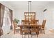 Formal dining room showcases a modern light fixture and wood dining set with seating for six at 11866 Weathered Edge Dr, Fishers, IN 46037