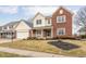 Beautiful two-story home featuring brick and siding exterior, a covered porch, and an attached two-car garage at 11866 Weathered Edge Dr, Fishers, IN 46037