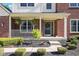 Inviting front porch with decorative plants, a stylish front door, and manicured landscaping, enhancing curb appeal at 11866 Weathered Edge Dr, Fishers, IN 46037