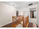 Upstairs hallway with hardwood floors leading to bedrooms at 11866 Weathered Edge Dr, Fishers, IN 46037