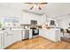Beautiful, bright kitchen featuring quartz countertops, stainless steel appliances, and mosaic backsplash at 11866 Weathered Edge Dr, Fishers, IN 46037