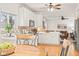 Bright kitchen features white cabinets, wood floors, modern appliances, and an eat-in dining area at 11866 Weathered Edge Dr, Fishers, IN 46037