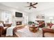 Cozy living room with fireplace, plush seating, and natural light, creating a comfortable gathering space at 11866 Weathered Edge Dr, Fishers, IN 46037