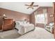 Comfortable primary bedroom with a vaulted ceiling, neutral tones, and a large window at 11866 Weathered Edge Dr, Fishers, IN 46037