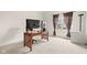 Bright home office with a modern work desk and view of the outdoors at 11866 Weathered Edge Dr, Fishers, IN 46037