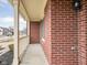 Close-up view of a brick porch with white railings, showcasing the architectural details and curb appeal at 11866 Weathered Edge Dr, Fishers, IN 46037