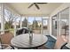 Screened-in porch with a grill, seating, and views of the backyard is great for entertaining at 11866 Weathered Edge Dr, Fishers, IN 46037
