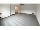 Spacious living room with neutral carpet and a ceiling fan at 1221 Kessler Blvd E Dr, Indianapolis, IN 46220