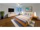 Stylishly furnished main bedroom featuring modern furniture, a ceiling fan, and a decorative area rug at 1221 Kessler Blvd E Dr, Indianapolis, IN 46220