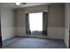Bedroom with blue carpet, two tone wallpaper and a ceiling fan at 1228 E Perry St, Indianapolis, IN 46227