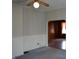Cozy living room with blue carpet, wainscoting and doorway at 1228 E Perry St, Indianapolis, IN 46227