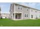 View of a green backyard and siding of the townhome at 1231 Langham St, Avon, IN 46123