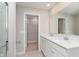 Bright bathroom features double sinks with white cabinets and a walk-in closet at 1231 Langham St, Avon, IN 46123