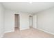 Spacious bedroom features neutral walls, plush carpeting, and multiple doors for easy access at 1231 Langham St, Avon, IN 46123