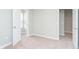 Neutral bedroom features neutral walls, plush carpeting, and doors leading to the rest of the home at 1231 Langham St, Avon, IN 46123