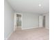 Spacious bedroom features neutral walls, plush carpeting, and two doors leading to bathrooms at 1231 Langham St, Avon, IN 46123