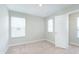 Bright bedroom features neutral walls, plush carpeting, and a convenient closet for optimal storage at 1231 Langham St, Avon, IN 46123