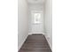Inviting entryway showcasing wood-look flooring and a door with privacy blinds at 1231 Langham St, Avon, IN 46123