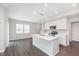 Well-lit kitchen featuring a large island, stainless steel appliances, and ample cabinet space at 1231 Langham St, Avon, IN 46123