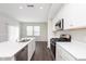 Modern kitchen with stainless appliances, an island, and sleek countertop at 1231 Langham St, Avon, IN 46123