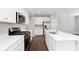 Well-appointed kitchen featuring stainless steel appliances, a large island, and ample counter space at 1231 Langham St, Avon, IN 46123