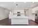 Contemporary kitchen boasts stainless steel appliances, island, and ample natural light at 1231 Langham St, Avon, IN 46123