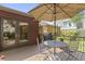 Outdoor entertaining on the deck with a table, chairs, and a grill; French doors to inside at 14 Kessler Blvd W Dr, Indianapolis, IN 46208