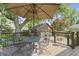Spacious back deck with patio furniture, a dining table, and a view of the backyard and garage at 14 Kessler Blvd W Dr, Indianapolis, IN 46208