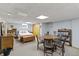 Finished basement room with a bed, dining set, and storage; ideal for a guest space at 14 Kessler Blvd W Dr, Indianapolis, IN 46208